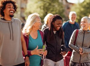 group of people walking and laughing outdoors