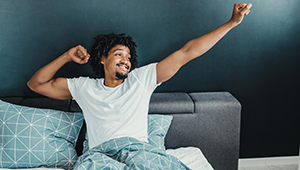 man waking up from sleep