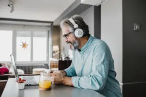 man with headphones on laptop