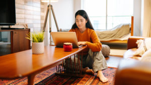Woman working at home laptop