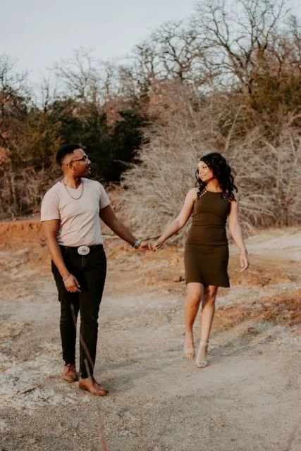 Couple walking outdoors at sunset, relaxed and smiling after a restful night of sleep