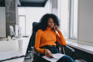 HR manager reviewing employee benefits documents as Medicaid coverage changes affect the workforce