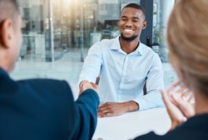 HR manager welcoming new employee at corporate wellness program meeting
