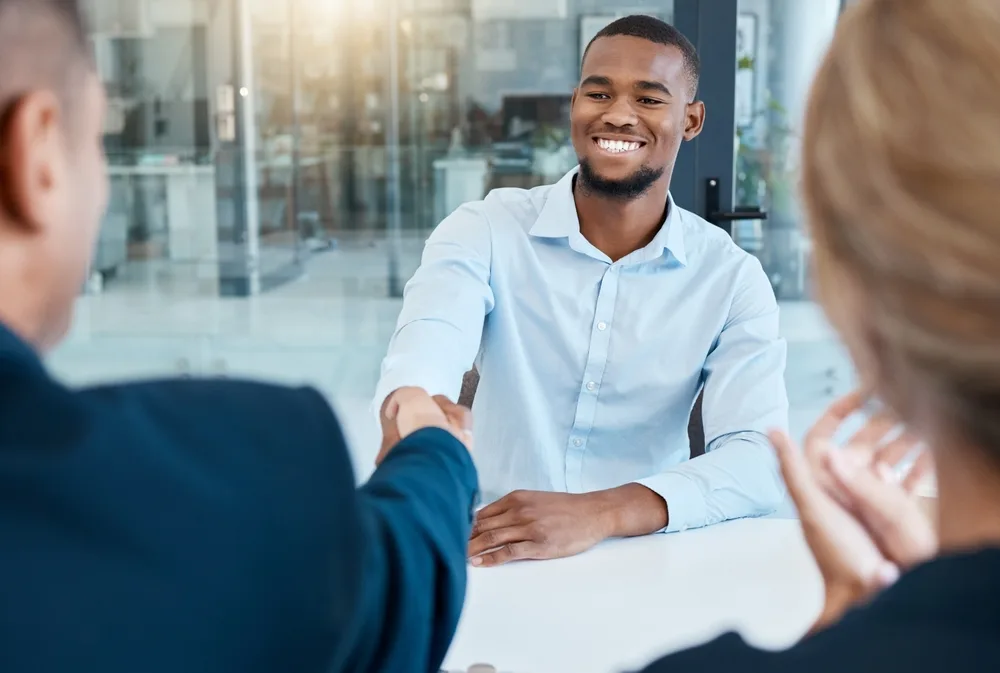 HR manager welcoming new employee at corporate wellness program meeting