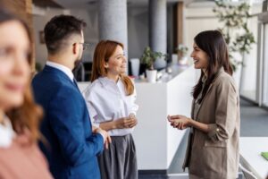 HR team discussing digital health coaching options in a modern office setting