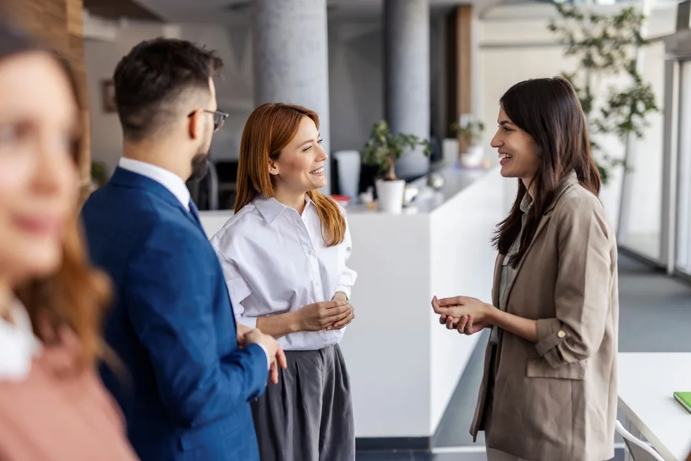 HR team discussing digital health coaching options in a modern office setting