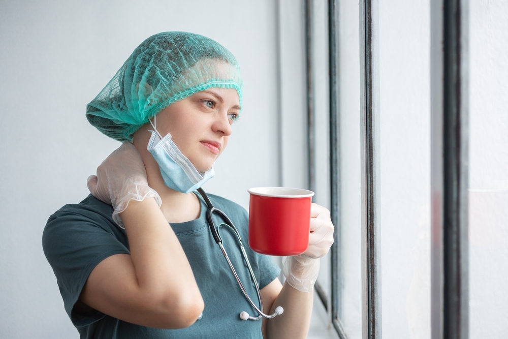 Night-shift worker using a mobile wellness program on a break