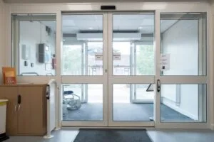 Entrance doors of an outpatient clinic seen from inside the lobby