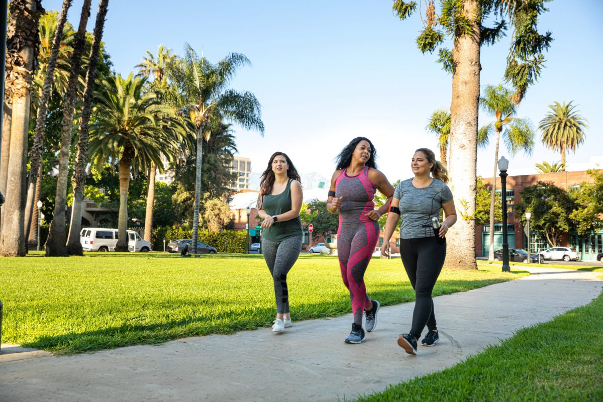 Young women jogging and getting healthy at the park